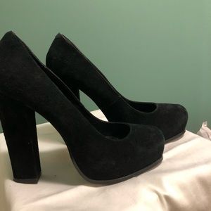 Black velvet heels with a high block style heel.